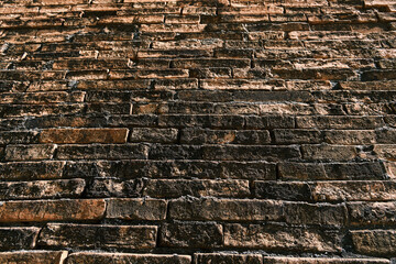 Naklejka premium old rusty dirty orange brick wall background wallpaper