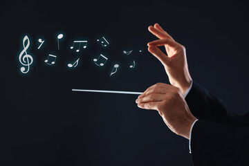 Conductor with baton and music notes on dark background, closeup