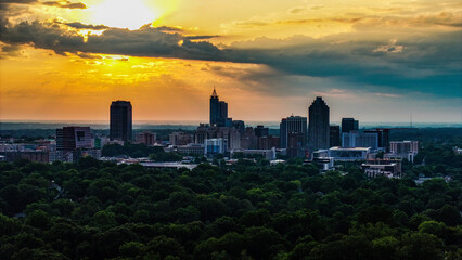 Fototapeta premium Raleigh Skyline at Sunrise with Dramatic Clouds - Aerial View