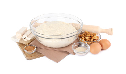 Fresh yeast dough and ingredients for cake on white background