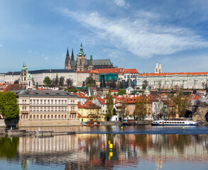 View of Charles bridge over Vltava river and Gradchany (Prague Castle) and St. Vitus Cathedral