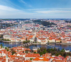 Fototapeta na wymiar Aerial view of Charles Bridge over Vltava river and Old city from Petrin hill Observation Tower. Prague, Czech Republic