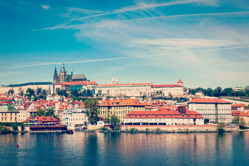 Fototapeta na wymiar Vintage retro hipster style travel image of Charles bridge over Vltava river and Gradchany (Prague Castle) and St. Vitus Cathedral