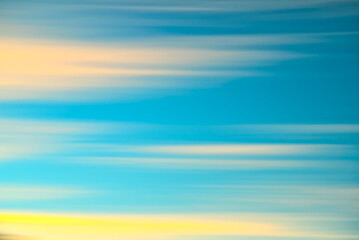 painterly abstract image of the  sunset and clouds, created with intentional movement of camera technique