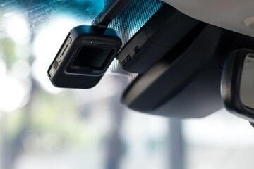 dashcam or car camera mounted on front windshield to record situation or accident ahead, selective...