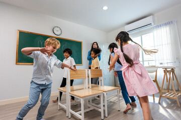 Group of student learn with teacher in classroom at elementary school. 