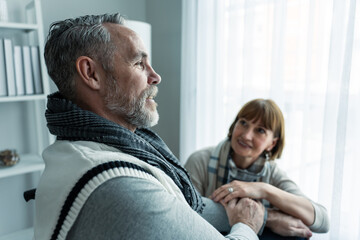 Obraz premium Caucasian senior wife support elderly husband sit on wheelchair at home. 