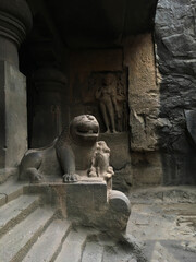 Entrance steps and sculpture in one of the caves of Ellora group of caves in Maharashtra. Ellora caves is one of the UNESCO World Heritages sites of India.