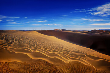 Fototapeta na wymiar Trekking men and camels in wide desert in evening light, AI generated