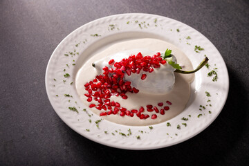 Chiles en Nogada, Typical dish from Mexico. Prepared with poblano chili stuffed with meat and fruits and covered with a walnut sauce. Named as the quintessential Mexican dish for national holidays.