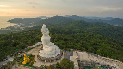 .aerial view Phuket big Buddha in beautiful sunset..amazing sun shines through the yellow clouds...