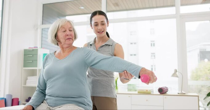 Senior woman, physical therapy and dumbbell exercise, stretching arm and support in physiotherapy exam. Workout, shoulder pain and fitness of elderly person, patient and nurse in medical consultation