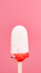 Vertical front view Popsicle sticks isolated on pink background.