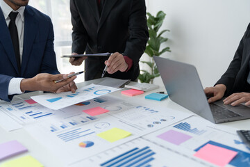 business professional Confident group of young business people analyzing strategies for brainstorming planning, calculations, data searching, idea presentation using laptop computers in the office.