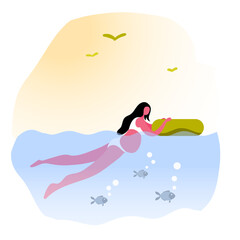 young pregnant mother swims with fish on the sea.Fitness and health for pregnant women.