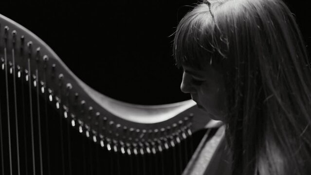 Woman Playing Harp in Black and White and Slow Motion