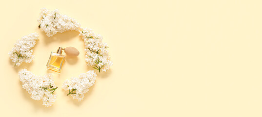 Frame made of white lilac flowers and bottle of perfume on light background with space for text
