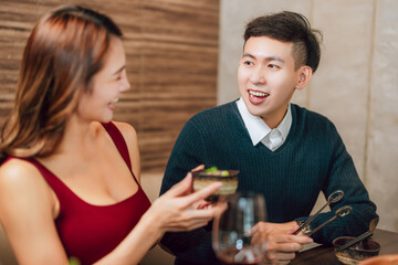 Happy couple dining in hotpots restaurant
