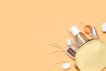Cosmetic bag with micellar water, cotton buds and balls on beige background