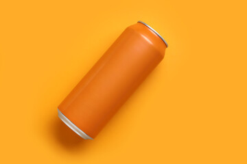 Can of soda on orange background
