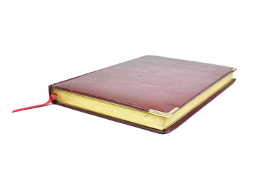 Dark red diary with ribbon isolated on white background. Close-up view