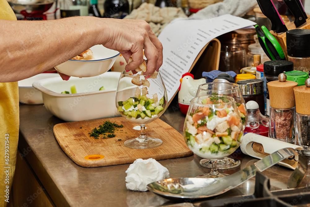 Canvas Prints Chef makes Summer salad in glass of salmon, cucumbers, croutons, herbs and fresh cream, Elegant Summer Fusion