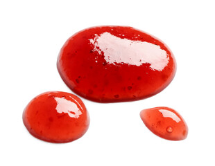 Fototapeta na wymiar Drops of sweet strawberry jam on white background