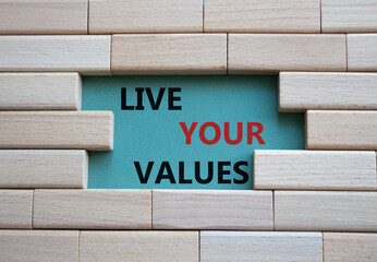 Live your values symbol. Concept words 'Live your values' on wooden blocks. Beautiful grey green...