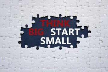Think big start small symbol. Concept words Think big start small on white puzzle. Beautiful black...