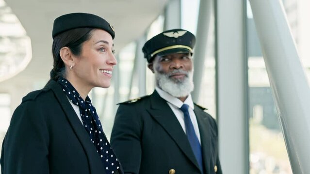 Travel, pilot and air hostess in discussion at the airport before boarding a flight in the city. Conversation, communication and hospitality air crew team talking about a strategy in urban town hotel