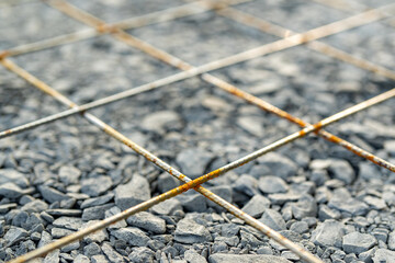 Welded wire mesh, WWM, installed within a sidewalk concrete form prior to the installation of concrete. 