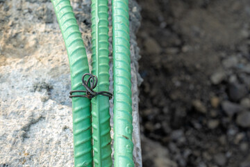 Epoxy coated rebar is used in concrete subjected to corrosive conditions.  These may include exposure to deicing salts or marine environments.