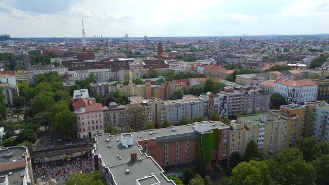 Unbelievable aerial top view flight CSD Pride Love Parade 2023 in city Berlin Germany Summer day. rotation to right panorama overview drone. 4K Cinematic footage.