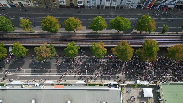 Wonderful aerial top view flight 
CSD Pride Love Parade 2023 in city Berlin Germany Summer day. vertical bird's eye view drone
4K Cinematic footage.