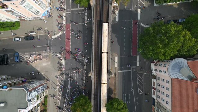 suburban railroad train. Nice aerial top view flight 
CSD Pride Love Parade 2023 in city Berlin Germany Summer day. vertical bird's eye view drone
4K Cinematic footage.