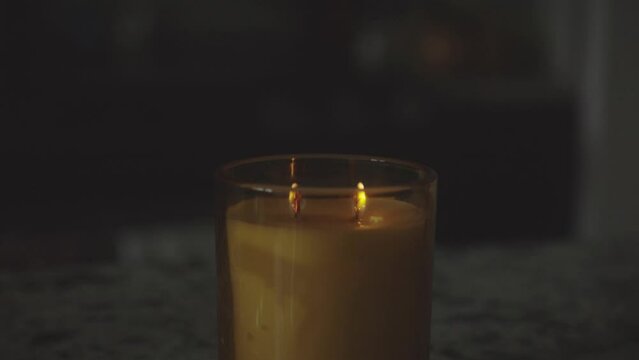Burning Candle With Two Wicks - close up