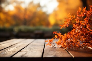 Naklejka na ściany i meble Wooden table with orange autumn leaves. Autumn background