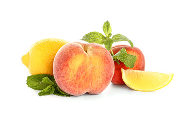 Fresh peaches, lemon and mint on white background