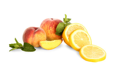 Fresh peaches, lemon and mint on white background