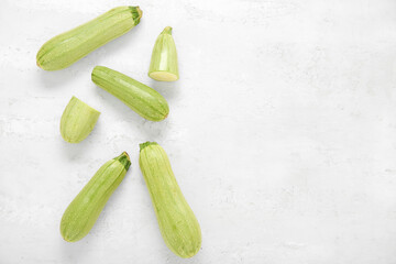 Fresh green zucchini on light background
