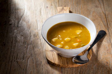 Vegetable soup on a wooden table