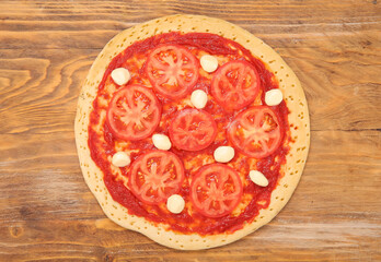 Tasty pizza on wooden background