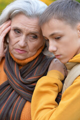Close up portrait of sad grandmother with grandson