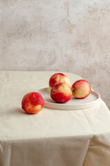 honey peach in wooden bowl on white background