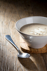 Cream of mushroom soup on a wooden table