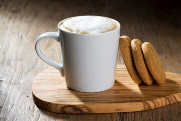 Biscuits and Coffee on a Rustic Wooden Table.