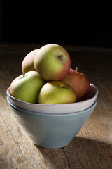 Bowl of Apple's on a rustic wooden table