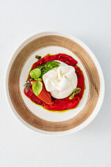 burrata with pepper and basil