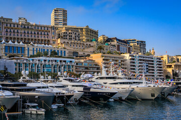 Luxury apartment buildings and yachts in the Yacht Club marina harbor for the Monaco Grand Prix F1...