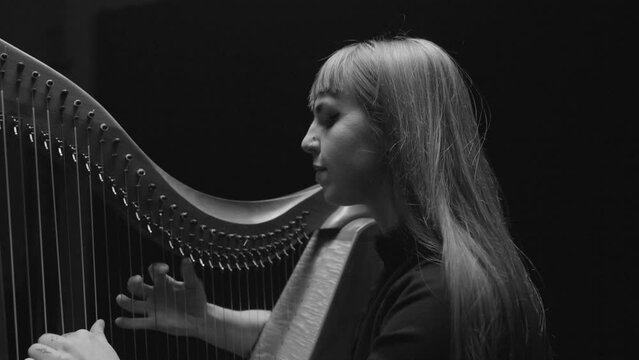 Woman Playing Harp